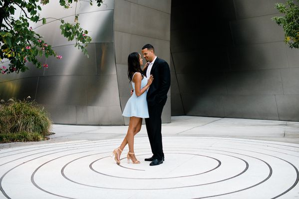 Couple embracing in modern outdoor plaza