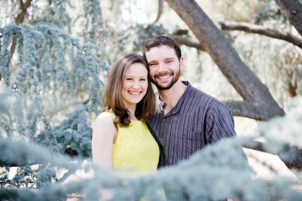 Smiling couple standing together outdoors