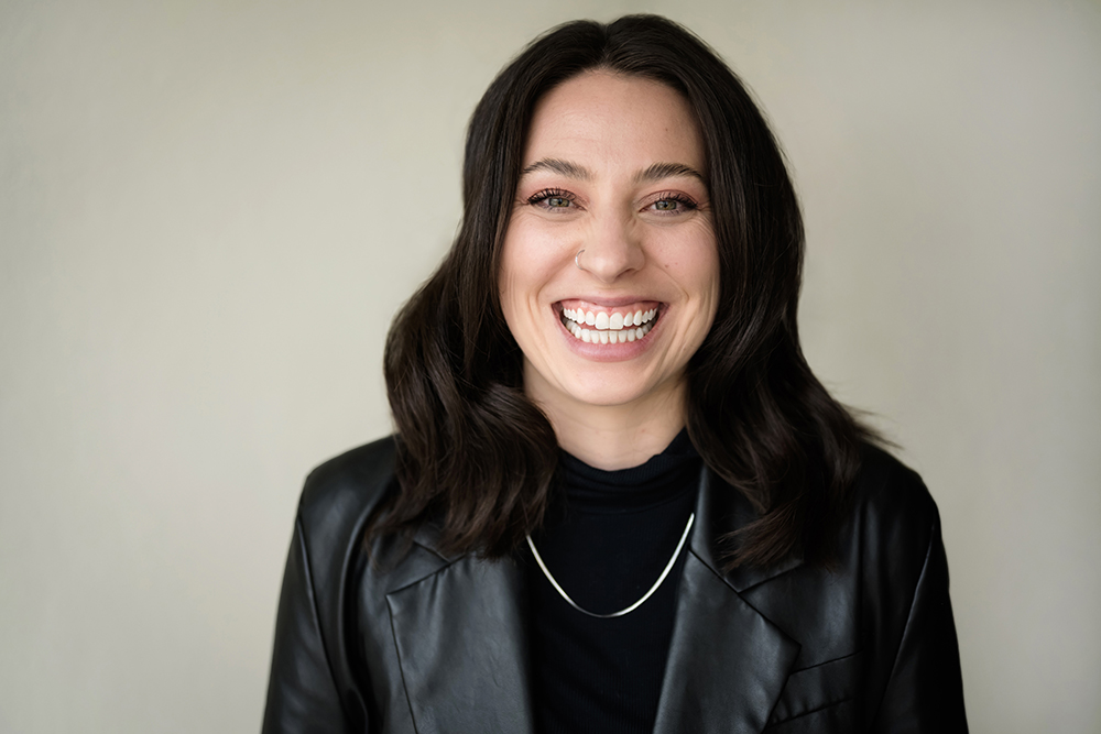 Smiling woman in black leather jacket